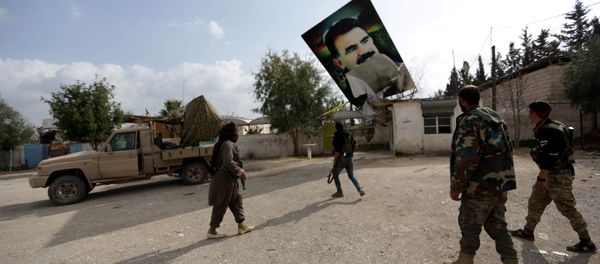 Turkish-backed Free Syrian Army fighters remove a picture of Kurdistan Workers Party (PKK) leader Abdullah Ocalan in Kafr Jana village north of Afrin, Syria March 7, 2018 Turkish-backed Free Syrian Army fighters remove a picture of Kurdistan Workers Party (PKK) leader Abdullah Ocalan in Kafr Jana village north of Afrin, Syria March 7, 2018 - Sputnik International