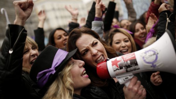 People, mostly women, shout slogans during a protest at the Sol square during the International Women's Day in Madrid, Thursday, March 8, 2018 People, mostly women, shout slogans during a protest at the Sol square during the International Women's Day in Madrid, Thursday, March 8, 2018 - Sputnik International
