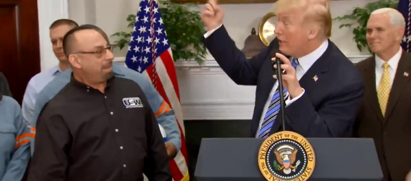 US President Donald Trump speaks with Scott Sauritch, the president of the United Steelworkers Union local 2227, prior to signing new tariffs measure on steel and aluminum imports. - Sputnik International