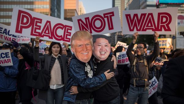 Demonstrators dressed as North Korean leader Kim Jong-Un (R) and US President Donald Trump (L) embrace during a peace rally in Seoul on November 5, 2017 Demonstrators dressed as North Korean leader Kim Jong-Un (R) and US President Donald Trump (L) embrace during a peace rally in Seoul on November 5, 2017 - Sputnik International
