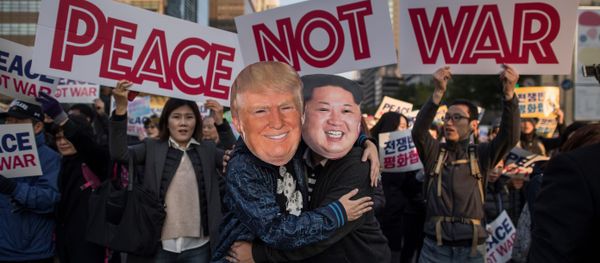 Demonstrators dressed as North Korean leader Kim Jong-Un (R) and US President Donald Trump (L) embrace during a peace rally in Seoul on November 5, 2017 Demonstrators dressed as North Korean leader Kim Jong-Un (R) and US President Donald Trump (L) embrace during a peace rally in Seoul on November 5, 2017 - Sputnik International