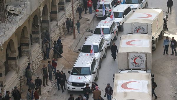 Trucks from Syrian Red Crescent and humanitarian partners are seen in Ghouta, Syria, March 5, 2018 in this picture obtained from social media - Sputnik International