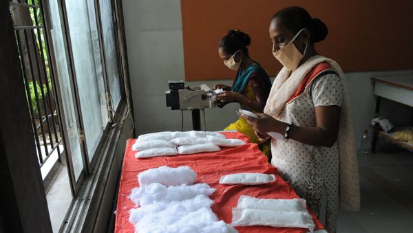 (File) Members of Self Employed Women's Association (SEWA) make low cost sanitary pads at their facility in Ahmedabad on September 3, 2012 - Sputnik International