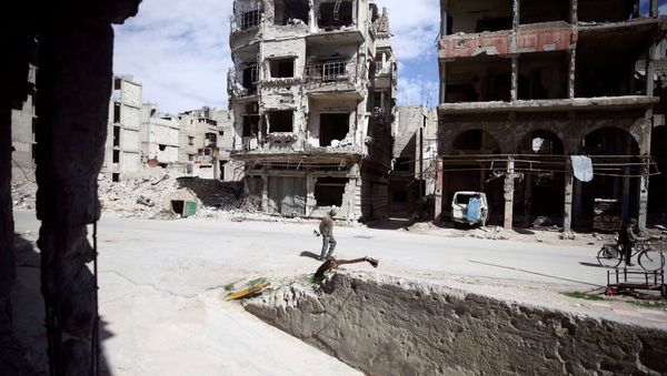 People are seen in the besieged town of Douma, Eastern Ghouta, in Damascus, Syria March 9, 2018 People are seen in the besieged town of Douma, Eastern Ghouta, in Damascus, Syria March 9, 2018 - Sputnik International