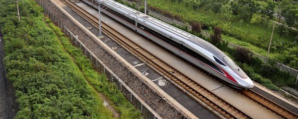 In this Aug. 21, 2017 photo released by China's Xinhua News Agency, a Fuxing bullet train, China's latest high-speed train, arrives at a train station in northern China's Tianjin Municipality In this Aug. 21, 2017 photo released by China's Xinhua News Agency, a Fuxing bullet train, China's latest high-speed train, arrives at a train station in northern China's Tianjin Municipality - Sputnik International