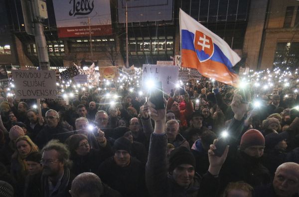 Demonstrators light with the torches of their smartphones during an anti-government rally in Bratislava, Slovakia, Friday, March 9, 2018. The country-wide protests demand a thorough investigation into the shooting deaths of Jan Kuciak and Martina Kusnirova, whose bodies were found in their home on Feb. 25, and also demand changes in the government. Demonstrators light with the torches of their smartphones during an anti-government rally in Bratislava, Slovakia, Friday, March 9, 2018. The country-wide protests demand a thorough investigation into the shooting deaths of Jan Kuciak and Martina Kusnirova, whose bodies were found in their home on Feb. 25, and also demand changes in the government. - Sputnik International