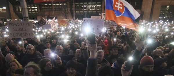 Demonstrators light with the torches of their smartphones during an anti-government rally in Bratislava, Slovakia, Friday, March 9, 2018. The country-wide protests demand a thorough investigation into the shooting deaths of Jan Kuciak and Martina Kusnirova, whose bodies were found in their home on Feb. 25, and also demand changes in the government. Demonstrators light with the torches of their smartphones during an anti-government rally in Bratislava, Slovakia, Friday, March 9, 2018. The country-wide protests demand a thorough investigation into the shooting deaths of Jan Kuciak and Martina Kusnirova, whose bodies were found in their home on Feb. 25, and also demand changes in the government. - Sputnik International