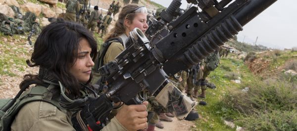 Israeli soldiers from the mixed-gender Lions of the Jordan battalion, under the Kfir Brigade, check their weapons at the end of the last training before being assigned their posting, on February 28, 2017, near the West Bank village of Bardale, east of Jenin Israeli soldiers from the mixed-gender Lions of the Jordan battalion, under the Kfir Brigade, check their weapons at the end of the last training before being assigned their posting, on February 28, 2017, near the West Bank village of Bardale, east of Jenin - Sputnik International