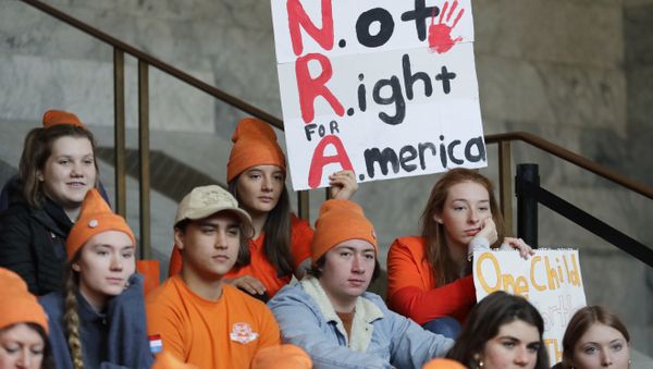 Lydia Ringer, 16, a junior at Roosevelt High School in Seattle, holds a sign that reads NRA - Not Right for America, Tuesday, March 6, 2018, as she attends a rally against gun violence at the Capitol in Olympia, Wash. The rally was held on the same day Gov. Inslee was scheduled to sign a bill banning the sale and possession of gun bump stocks in the state of Washington. - Sputnik International
