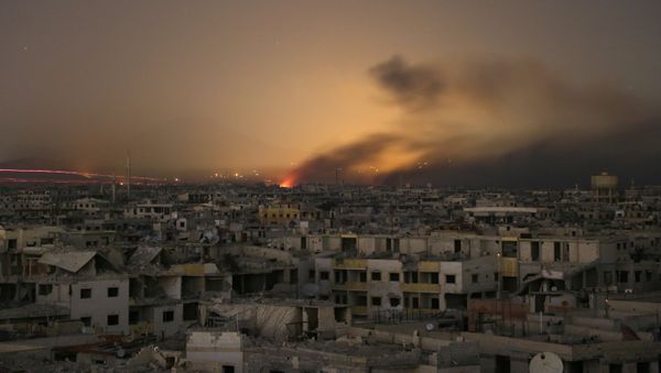 Lights and smoke are seen during Syrian government bombardment on the rebel-controlled town of Arbin, in the besieged Eastern Ghouta region on the outskirts of the capital Damascus, on late March 11, 2018 - Sputnik International