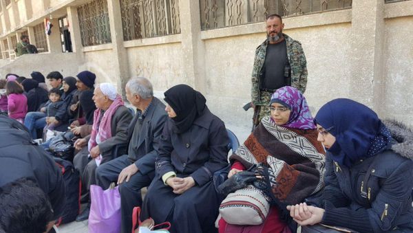 Second group of civilians left Syria's Duma located in Eastern Ghouta via a humanitarian corridor to the Muhayam al-Wafedin checkpoint Second group of civilians left Syria's Duma located in Eastern Ghouta via a humanitarian corridor to the Muhayam al-Wafedin checkpoint - Sputnik International