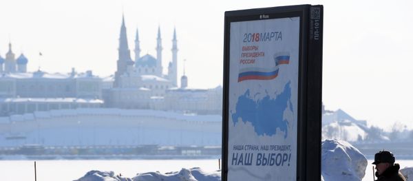A billboard with the logo of the 2018 Russian presidential election, in Kazan. Background: the Qolşärif Mosque of the Kazan Kremlin A billboard with the logo of the 2018 Russian presidential election, in Kazan. Background: the Qolşärif Mosque of the Kazan Kremlin - Sputnik International