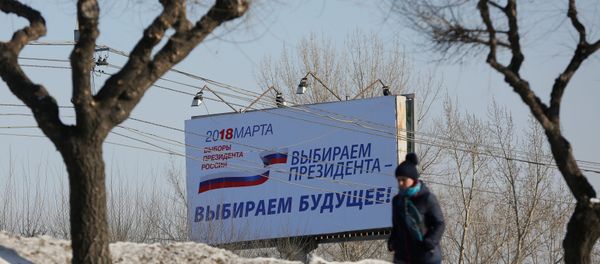 A woman walks past a billboard advertising the upcoming presidential election, in Krasnoyarsk, Russia March 11, 2018 A woman walks past a billboard advertising the upcoming presidential election, in Krasnoyarsk, Russia March 11, 2018 - Sputnik International