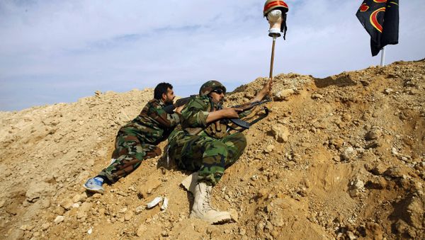 FILE - This Friday, Nov. 22, 2013 file photo, Iraqi and Lebanese Shiite fighters from a group called the Hussein Brigade use a helmet to draw a sniper into view in the town of Hejeira, in the countryside of Damascus, Syria - Sputnik International