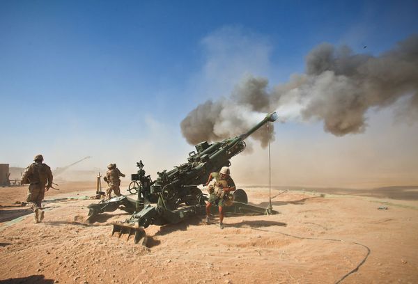 Marines with Charlie Battery, 1st Battalion, 12th Marine Regiment, fire an M982 Excalibur round from an M777 howitzer during a recent fire support mission - Sputnik International
