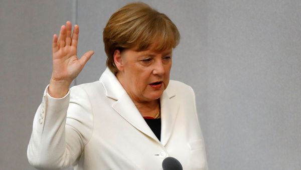 German Chancellor Angela Merkel is sworn-in by Parliament President Wolfgang Schaeuble (not pictured) during a meeting of Germany's lower house of parliament Bundestag in Berlin, Germany, March 14, 2018 German Chancellor Angela Merkel is sworn-in by Parliament President Wolfgang Schaeuble (not pictured) during a meeting of Germany's lower house of parliament Bundestag in Berlin, Germany, March 14, 2018 - Sputnik International