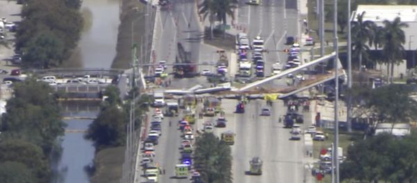 In this frame from video, emergency personnel work at the scene of a collapsed bridge in the Miami area, Thursday, March 15, 2018. - Sputnik International
