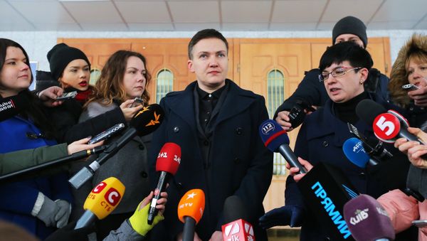 Ukraine's Verkhovna Rada deputy Nadezhda Savchenko talks to journalists near the Ukrainian Security Service building in Kiev - Sputnik International