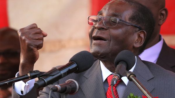 President of Zimbawe Robert Mugabe gestures as he addresses supporters of his ruling ZANU (PF) party (File) - Sputnik International