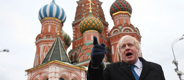 British Foreign Secretary Boris Johnson stands in front of Saint Basil's cathedral in Red square in Moscow on December 22, 2017 after a meeting with his Russian counterpart. - Sputnik International