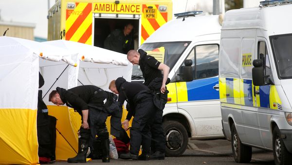 Police officers get dressed in protective suiting at a car recovery depot in Norton Enterprise Park, where Sergei Skripal's car was originally transported, in Salisbury, Britain, March 13, 2018 Police officers get dressed in protective suiting at a car recovery depot in Norton Enterprise Park, where Sergei Skripal's car was originally transported, in Salisbury, Britain, March 13, 2018 - Sputnik International