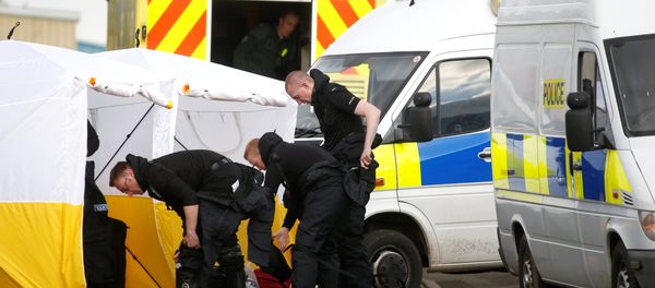 Police officers get dressed in protective suiting at a car recovery depot in Norton Enterprise Park, where Sergei Skripal's car was originally transported, in Salisbury, Britain, March 13, 2018 Police officers get dressed in protective suiting at a car recovery depot in Norton Enterprise Park, where Sergei Skripal's car was originally transported, in Salisbury, Britain, March 13, 2018 - Sputnik International