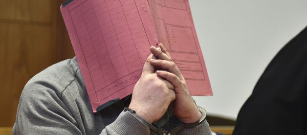 In this Feb. 26, 2015 file photo former nurse Niels Hoegel., accused of multiple murder and attempted murder of patients, covering his face with a file at the district court in Oldenburg, Germany In this Feb. 26, 2015 file photo former nurse Niels Hoegel., accused of multiple murder and attempted murder of patients, covering his face with a file at the district court in Oldenburg, Germany - Sputnik International