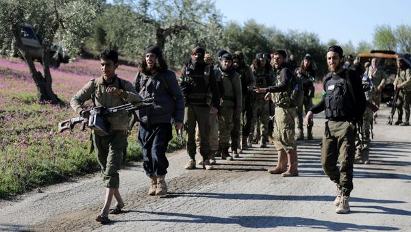 Turkish-backed Free Syrian Army fighters walk together after advancing north of Afrin, Syria March 17, 2018 - Sputnik International