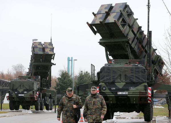 Soldiers of the Air Defence Missile Squadron 2 walk past Patriot missile launchers in the background in Bad Suelze, northern Germany on December 4, 2012 Soldiers of the Air Defence Missile Squadron 2 walk past Patriot missile launchers in the background in Bad Suelze, northern Germany on December 4, 2012 - Sputnik International