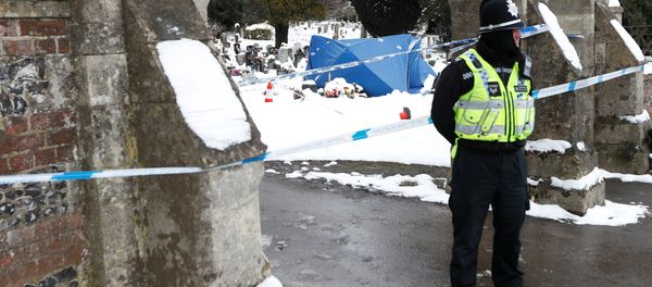 A police officer stands outside the London Road cemetery where the grave of Alexander Skripal; son of former Russian intelligence officer Sergei Skripal; is seen covered with a tent, in Salisbury, Britain - Sputnik International