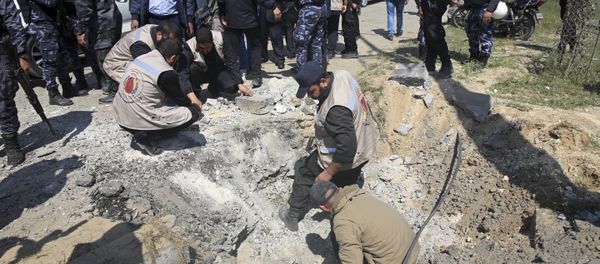 Hamas security services personnel inspect the site of a Tuesday explosion that occurred as the convoy of Palestinian Prime Minister Rami Hamdallah entered Gaza through the Erez crossing with Israel, on the main road in Beit Hanoun, Gaza Strip, Tuesday, March 13, 2018 Hamas security services personnel inspect the site of a Tuesday explosion that occurred as the convoy of Palestinian Prime Minister Rami Hamdallah entered Gaza through the Erez crossing with Israel, on the main road in Beit Hanoun, Gaza Strip, Tuesday, March 13, 2018 - Sputnik International
