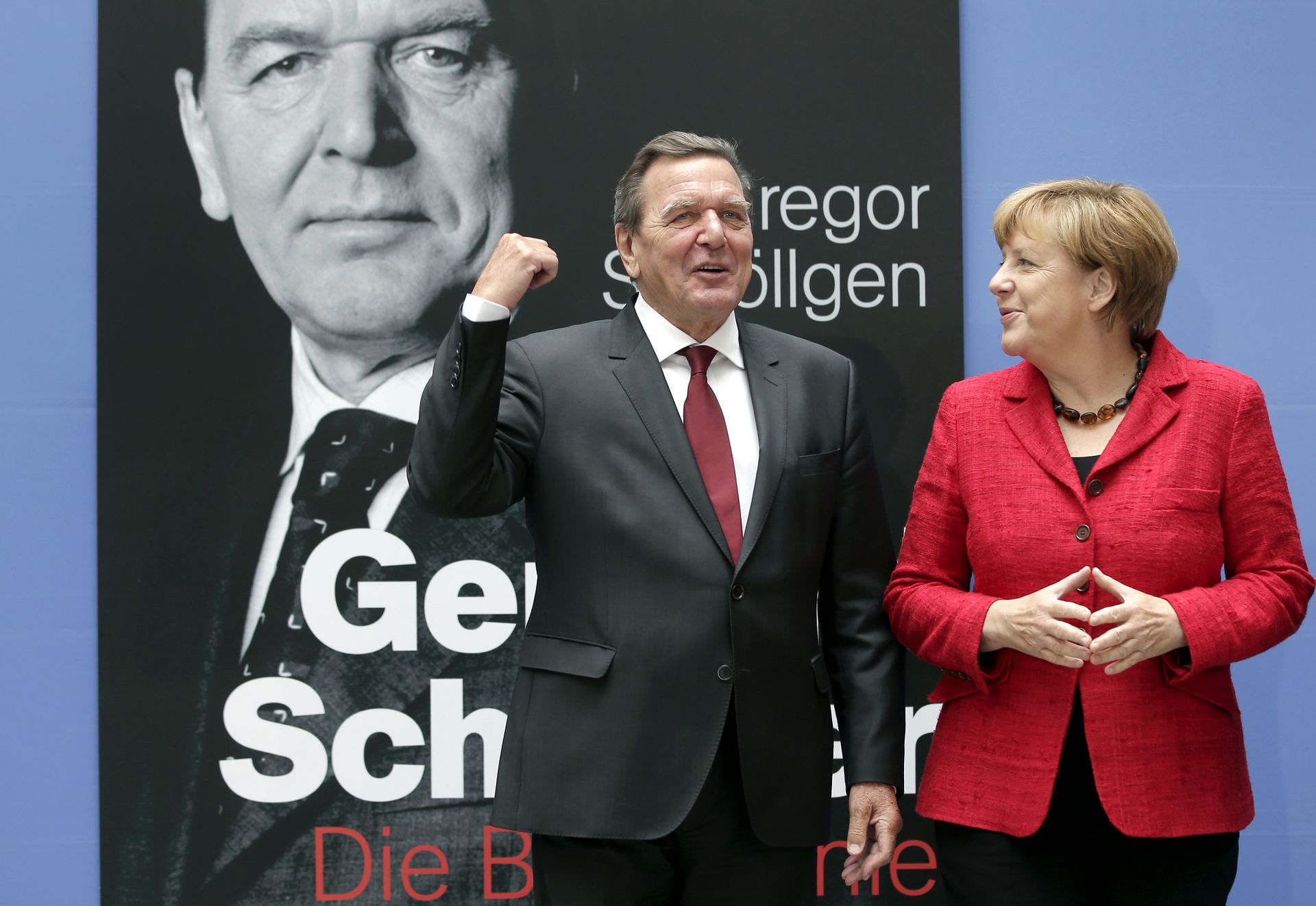 German Chancellor Angela Merkel, right, and former German Chancellor Gerhard Schroeder, left, pose during a photo call prior to the book presentation of Schroeder's biography in Berlin, Germany, Tuesday, Sept. 22, 2015 - Sputnik International, 1920, 09.02.2022