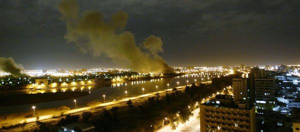 In this March 20, 2003 file photo, smoke rises from the Trade Ministry in Baghdad after it was hit by a missile during US-led forces attacks - Sputnik International