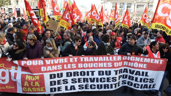 People hold CGT union flags and hold a banner as they take part in a demonstration to protest against French government's string of reforms, on March 22, 2018 in Marseille, southern France - Sputnik International