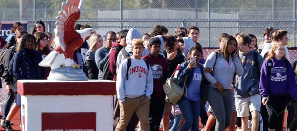 Students walk out of Marjory Stoneman Douglas High School as part of a National School Walkout to honor the 17 students and staff members killed at the school in Parkland, Florida, U.S., March 14, 2018. Students walk out of Marjory Stoneman Douglas High School as part of a National School Walkout to honor the 17 students and staff members killed at the school in Parkland, Florida, U.S., March 14, 2018. - Sputnik International