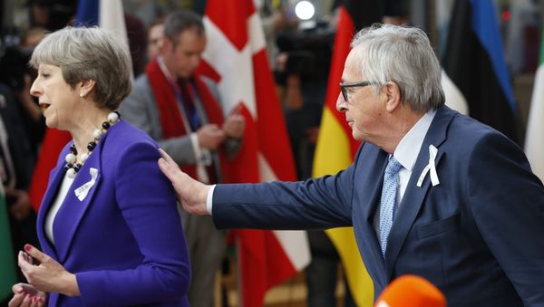European Commission President Jean-Claude Juncker and Britain's Prime Minister Theresa May arrive at a European Union leaders summit in Brussels, Belgium, March 22, 2018. European Commission President Jean-Claude Juncker and Britain's Prime Minister Theresa May arrive at a European Union leaders summit in Brussels, Belgium, March 22, 2018. - Sputnik International