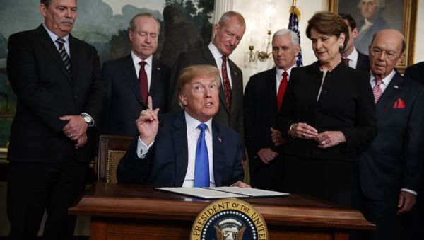 President Donald Trump speaks before he signs a presidential memorandum imposing tariffs and investment restrictions on China in the Diplomatic Reception Room of the White House, Thursday, March 22, 2018, in Washington. - Sputnik International