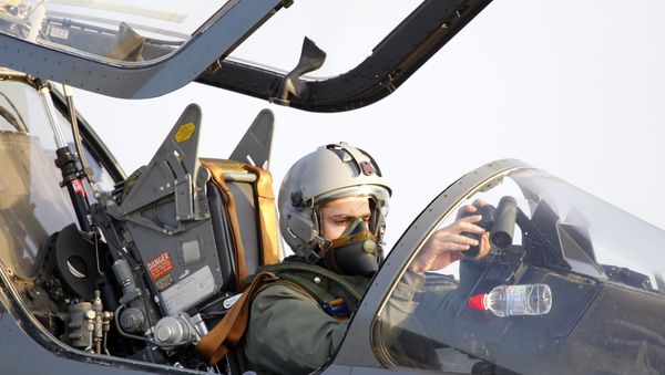 The French pilot of an Air Force Mirage 2000 jet fighter prepares to take off for a mission to Libya, at Solenzara 126 Air Base, on Corsica Island. (File) - Sputnik International