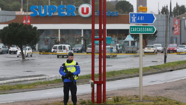 A French gendarme secures the access to a supermarket after a hostage situation in Trebes, France - Sputnik International