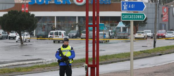 A French gendarme secures the access to a supermarket after a hostage situation in Trebes, France A French gendarme secures the access to a supermarket after a hostage situation in Trebes, France - Sputnik International