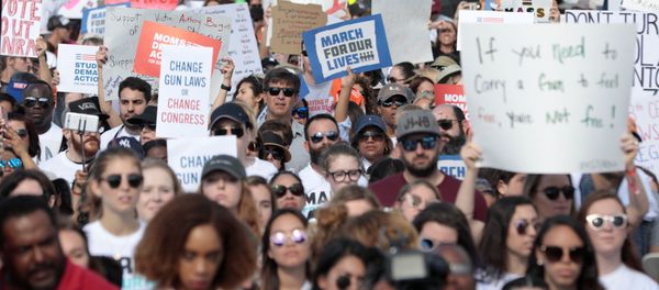 People and students hold signs while rallying in the street during the March for Our Lives demanding stricter gun control laws at the Miami Beach Senior High School, in Miami, Florida, U.S People and students hold signs while rallying in the street during the March for Our Lives demanding stricter gun control laws at the Miami Beach Senior High School, in Miami, Florida, U.S - Sputnik International