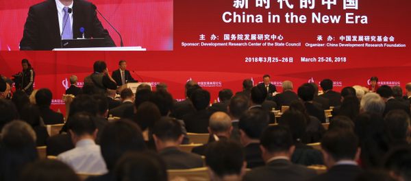 China's Central Bank Governor Yi Gang delivers a speech at the China Development Forum at the Diaoyutai State Guesthouse in Beijing, Sunday, March 25, 2018 - Sputnik International