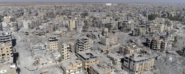 (File) This Thursday, Oct. 19, 2017 frame grab made from drone video shows damaged buildings in Raqqa, Syria (File) This Thursday, Oct. 19, 2017 frame grab made from drone video shows damaged buildings in Raqqa, Syria - Sputnik International