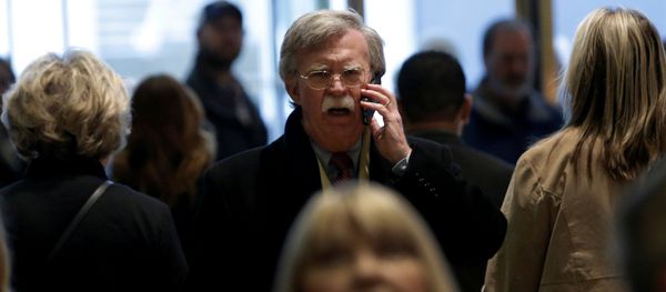 Former U.S. Ambassador to the United Nations John Bolton speaks on a mobile phone as he arrives for a meeting with U.S. President-elect Donald Trump at Trump Tower in New York, U.S., December 2, 2016 - Sputnik International
