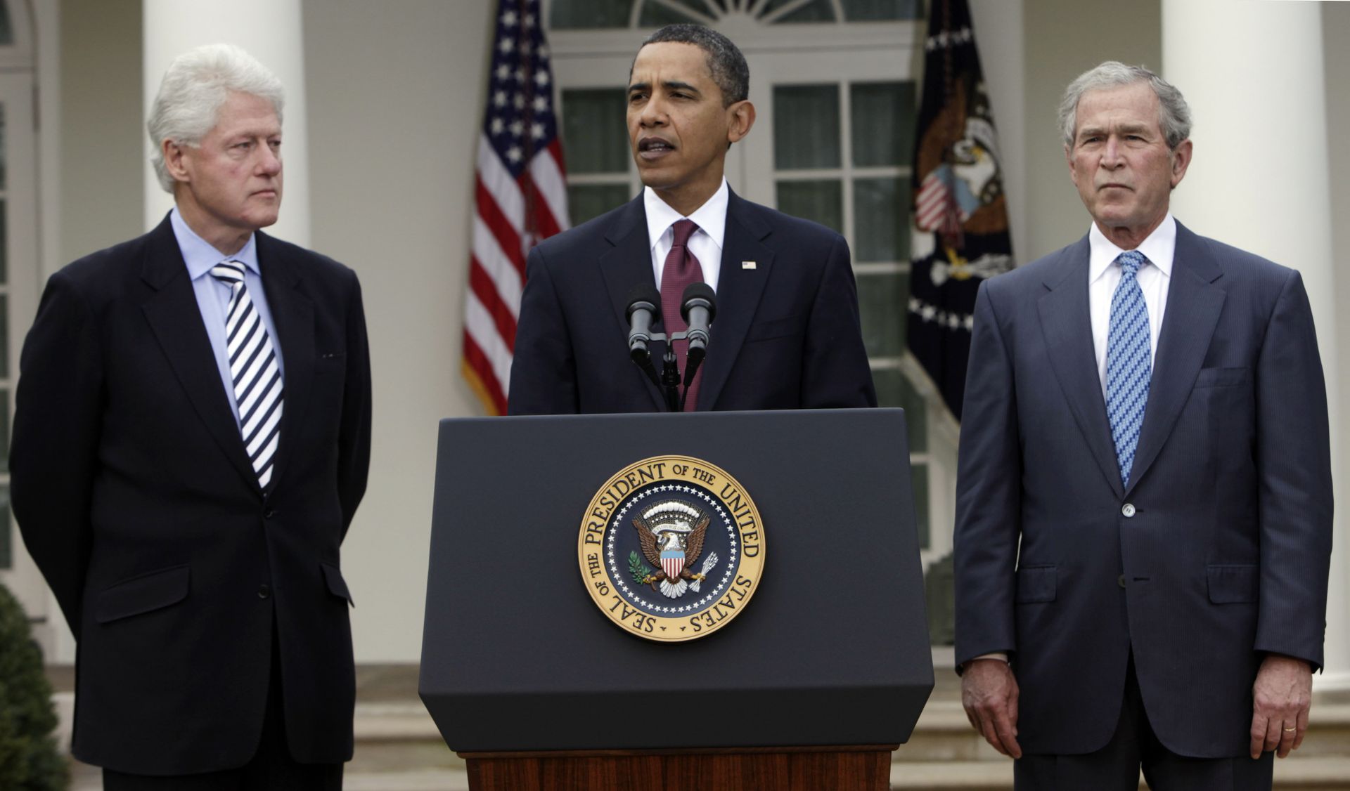 President Barack Obama, center, speaks about Haiti as former presidents Bill Clinton, left, and George W. Bush, right, listen in the Rose Garden at the White House in Washington Saturday, Jan. 16, 2010.  - Sputnik International, 1920, 05.10.2021