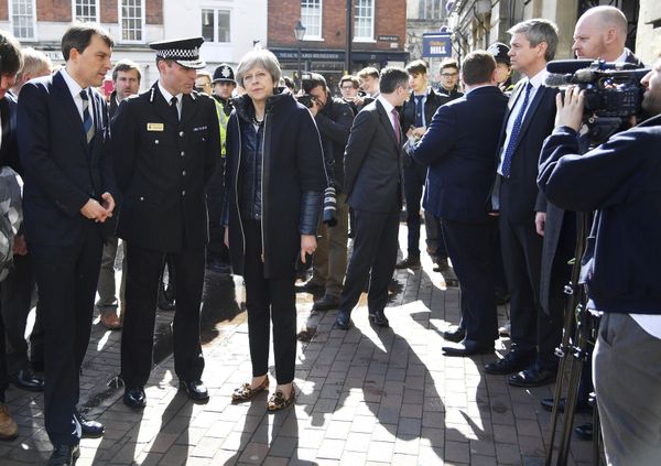 Britain's Prime Minister Theresa May, centre, is briefed by members of the police as she views the area where former Russian double agent Sergei Skripal and his daughter were found critically ill, in Salisbury, England, Thursday, March 15, 2018 - Sputnik International
