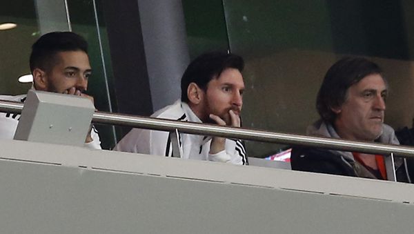 Argentina's Lionel Messi, center, watches from the tribune during the international friendly soccer match between Spain and Argentina at the Wanda Metropolitano stadium in Madrid, Spain, Tuesday March 27, 2018 Argentina's Lionel Messi, center, watches from the tribune during the international friendly soccer match between Spain and Argentina at the Wanda Metropolitano stadium in Madrid, Spain, Tuesday March 27, 2018 - Sputnik International