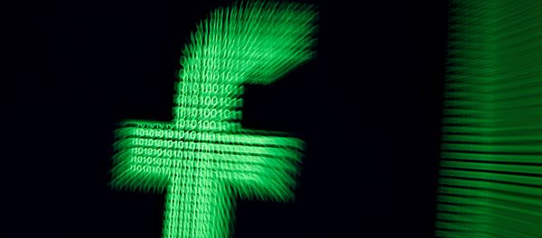 A 3D-printed Facebook logo are seen in front of displayed binary digits in this illustration taken, March 18, 2018 A 3D-printed Facebook logo are seen in front of displayed binary digits in this illustration taken, March 18, 2018 - Sputnik International