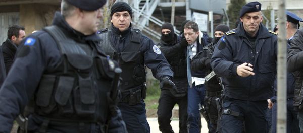 Kosovo police escort Marko Djuric a Serb official to a police station in Kosovo capital Pristina after he was arrested in northern Kosovo town of Mitrovica on Monday, March 26, 2018 - Sputnik International