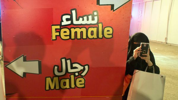 Visitor takes pictures at the entrance of the female section, during the Saudi Comic Con (SCC) which is the first event of its kind to be held in Jiddah, Saudi Arabia. (File) - Sputnik International